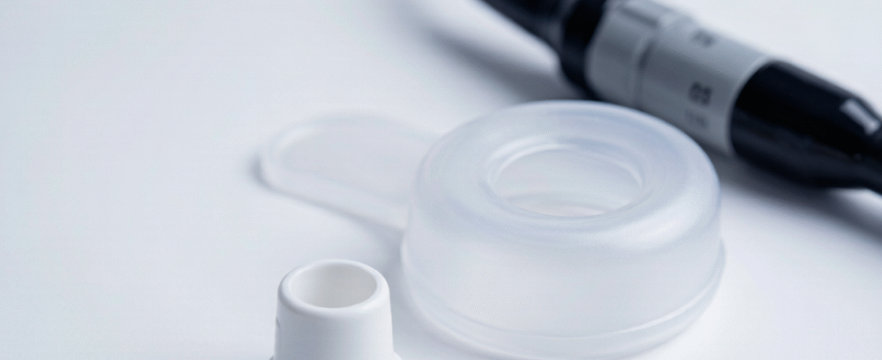 Endoscope waterproof cover and disposable biopsy port cap on a clean clinical surface